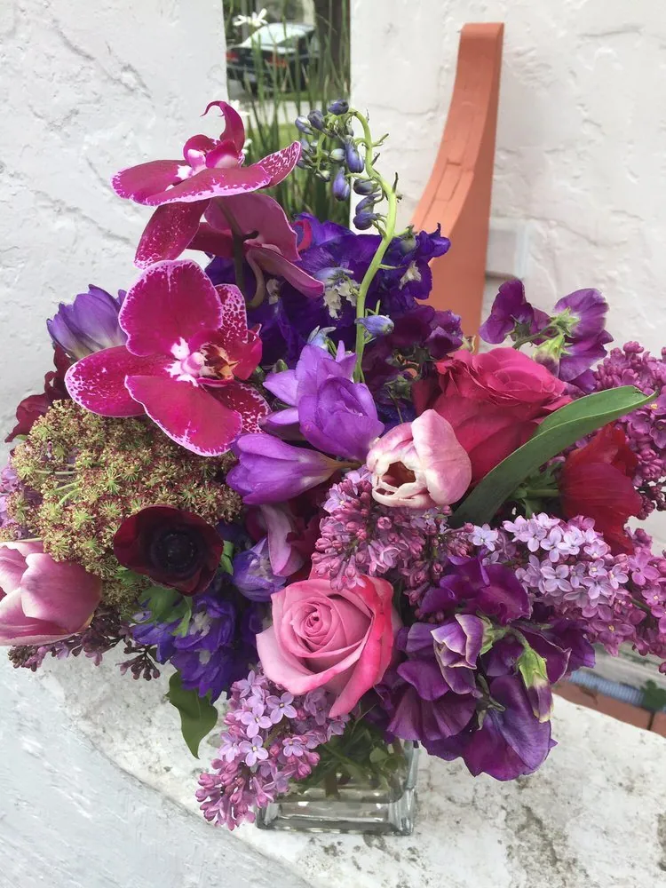 Purple orchid and pink floral arrangement by Margaret Rose Floral Design.